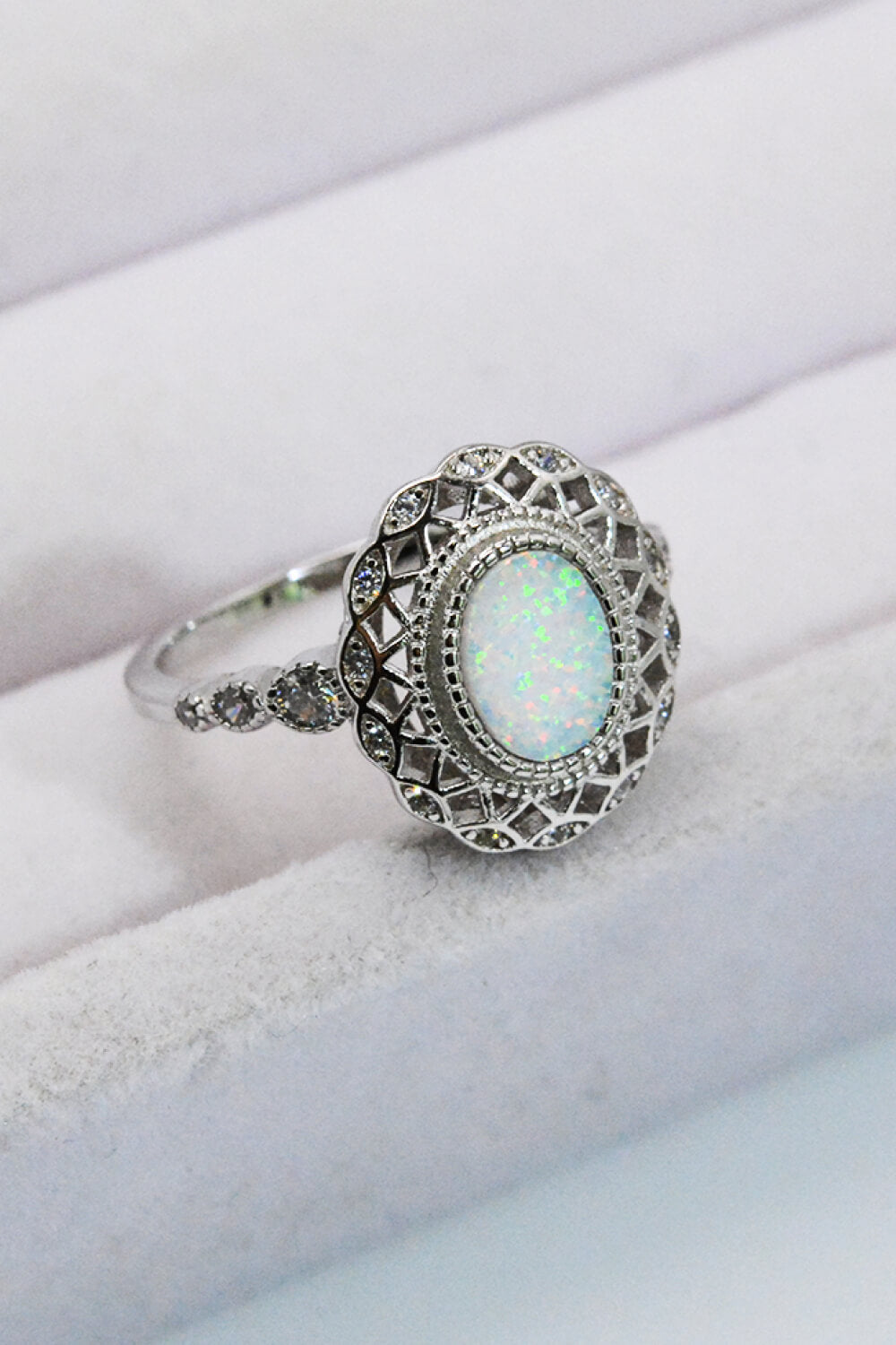 Feeling The Love 925 Sterling Silver Opal Ring displayed in a flat lay style, showcasing its minimalist design and opal stone.